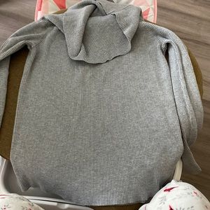 This trendy gray turtle neck works as both and turtle neck and off the shoulder